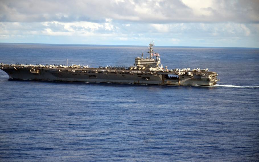 The USS Ronald Reagan sails in formation during a multi-carrier exercise in the Philippine Sea, Monday, Nov. 6, 2023. 
