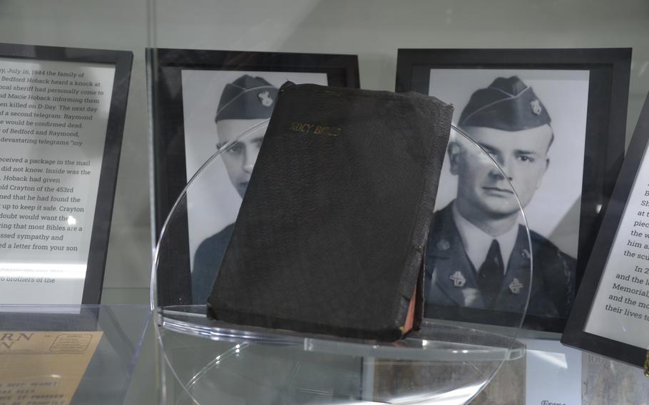 Staff Sgt. Raymond Hoback’s Bible on display at the National D-Day Memorial in Bedford, Va., on May 11, 2024. Raymond and his brother, Bedford, died on D-Day. Raymond’s Bible was recovered and returned to his family. His sister, Lucille Hoback Boggess, donated her brother’s Bible to the memorial in November. 