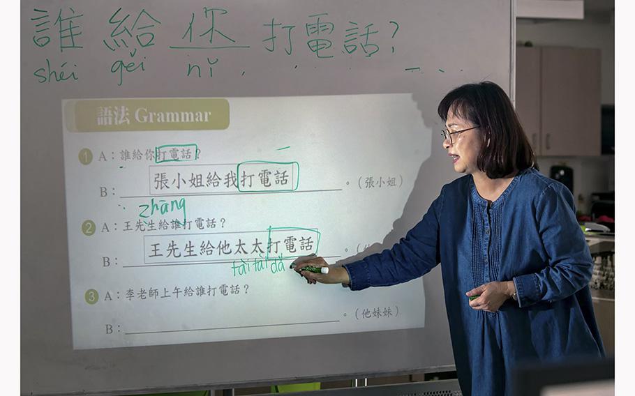 Kelly Chuang teaches a class of Mandarin language at Chinese School of San Marino on April 1, 2023.