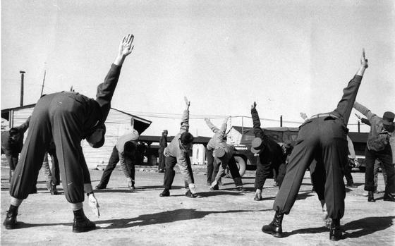 48th Surgical Hospital, South Korea, Nov. 24, 1958: "Reconditioning exercises" are led by SP5 Wallace C. Henninger, chief ward master, and SFC Harold Kelleher, training NCO. The U.S.48th Surgical Hospital in Korea is an unusual organization as it provides care for convalescent patients only. The hospital, under the command of Maj. James Shafer, is equipped with modern facilities for rehabilitating patients and therapy and physical exercises are emphasized in the treatment of men. 

Looking for Stars and Stripes’ historic coverage? Subscribe to Stars and Stripes’ historic newspaper archive! We have digitized our 1948-1999 European and Pacific editions, as well as several of our WWII editions and made them available online through https://starsandstripes.newspaperarchive.com/

META TAGS:  military medical; hospital; health care; patient; rehabilitation; physical therapy; exercise; U.S. Army; servicemember