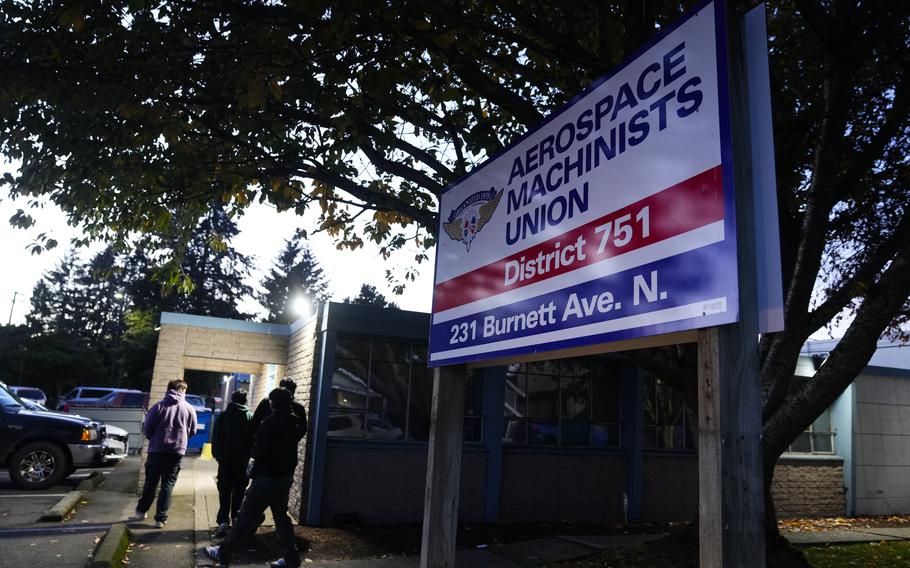 Boeing employees arrive to vote on a new contract offer from the company Monday, Nov. 4, 2024, at the Aerospace Machinists Union hall in Renton, Wash. 