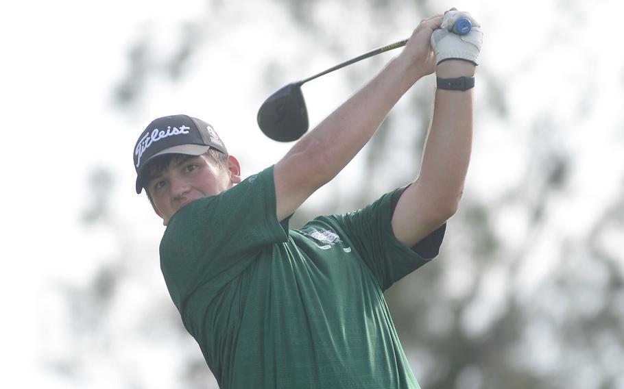 Boys champion Matt Burn tees off on the 530-yard, par-5 16th hole.