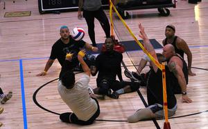 Team Army is taking advantage of some practice time during a sitting volleyball workout during the 2024 Department of Defense Warrior Games at the ESPN Wide World of Sports Complex in Orlando, Florida, June 20, 2024. Service members and veterans from the Army, Air Force, Marine Corps, Navy, U.S. Special Operations Command, and representatives from the Australian Defence Force are competing in adaptive sports including archery, cycling, indoor-rowing, powerlifting, shooting, sitting volleyball, swimming, track, field, wheelchair basketball and wheelchair rugby from June 21 – 30, at the Walt Disney World Resort. (DOD photo by Robert A. Whetstone)