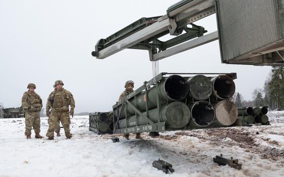 Members of the U.S. Army-led Task Force Voit load a High Mobility Artillery Rocket System with test rockets at the Central Training Area near Tapa, Estonia, on Jan. 27, 2025, as part of a live-fire exercise.