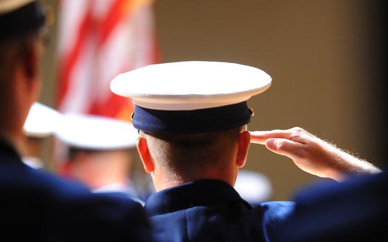 MEMPHIS, Tenn. - A Coast Guard member at a ceremoney during which Master Chief Petty Officer Steven Hearn is relieved of duties as the Coast Guard's Silver Ancient Mariner byMaster Chief Petty Officer Lloyd Pierce, command master chief at the Coast Guard Academy,and as the Coast Guard Cutter Kankakee's officer in charge byChief Warrant Officer Nick Frascella,in Millington, Tenn., Aug. 19, 2011.The ancient mariner position is held by the officer (gold) and enlisted person (silver) with the earliest date of qualification as a cutterman. U.S. Coast Guard photo by Petty Officer 2nd Class Patrick Kelley.