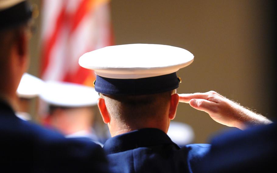 A Coast Guard member saluting