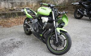 A green Kawaski brand motorcycle is shown.