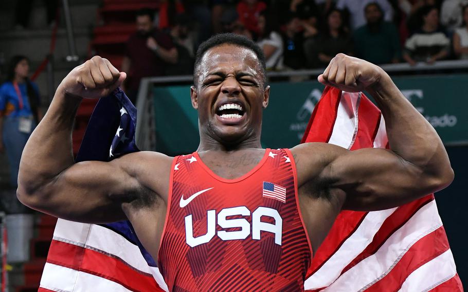 Army Spc. Kamal Bey celebrates after he won the 77 kilogram gold medal in Greco-Roman wrestling at the Pan American Games in Santiago, Chile in 2023. Bey will be competing in the 2024 Paris Olympics.