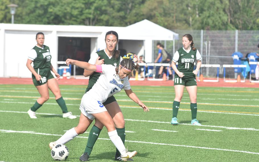 AFNORTH's Maggie Masse ties up Sigonella's Charlize Cano on Thursday, May 23, 2024, in the championship game of the DODEA European Division III girls soccer tournament at Ramstein High School, Germany. The Lions won 2-0.