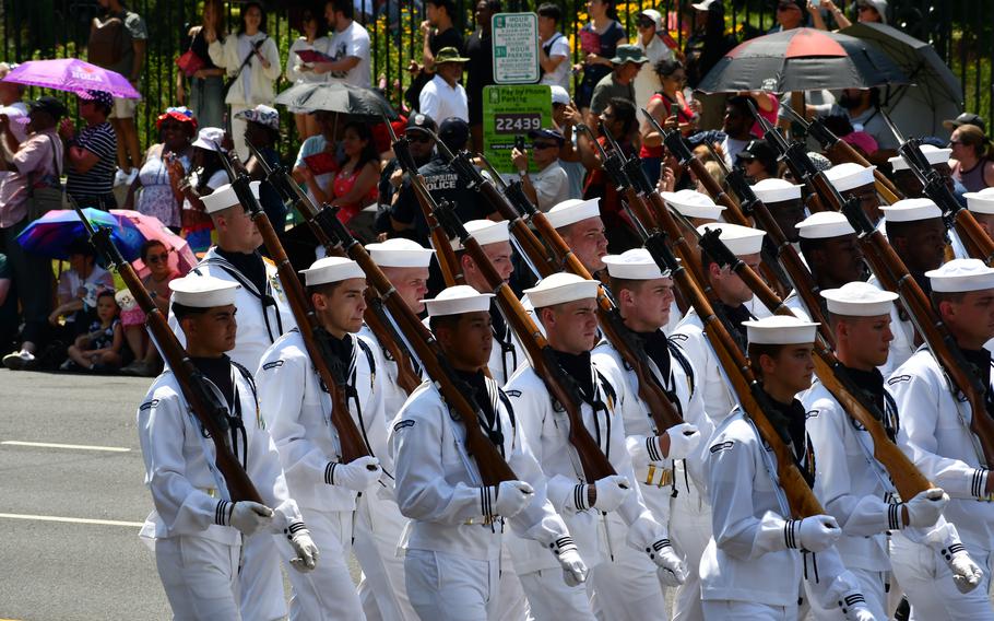 Navy Sailors in dress whites march in the Independence Day parade in Washington, D.C. on July 4, 2024.