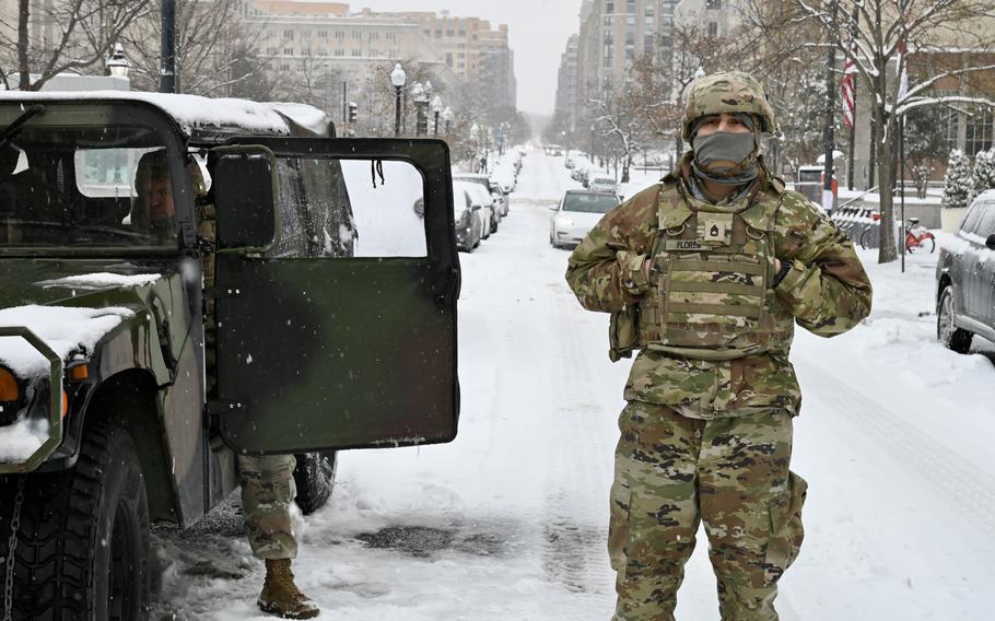 National Guard soldier stands outside in the snow