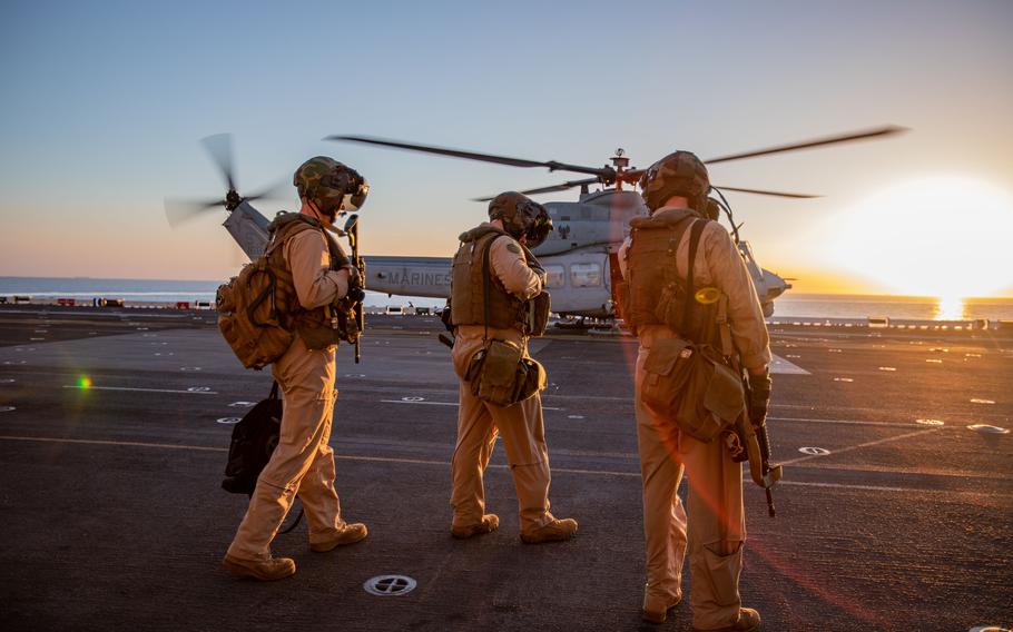 U.S. Marines prepare to board a UH-1Y Venom during a rehearsal on the USS Bataan in the Red Sea on Aug. 7, 2023.