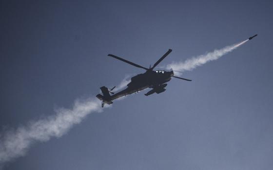 An Israeli helicopter fires a missile toward southern Lebanon.