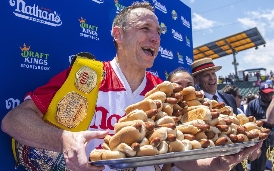 oey Chestnut, winner of the 2021 Nathan’s Famous Fourth of July International Hot Dog-Eating Contest, poses for photos in Coney Island’s Maimonides Park, July 4, 2021, in the Brooklyn borough of New York. Chestnut will take his hot dog-downing talents to Fort Bliss for America’s Independence Day this year.