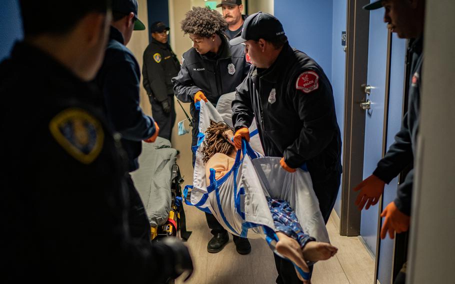 San Diego Paramedics try to save a woman in her 30s outside her apartment after she overdosed on what they think is fentanyl.