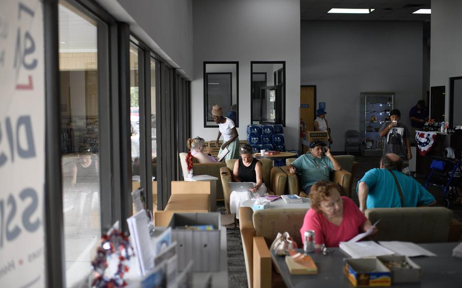 Residents cool off and charge electronics at a community center after Hurricane Beryl in Houston on July 10. 