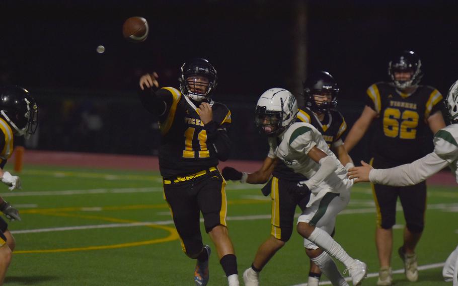 Vicenza quarterback Maxwell Thrash gets a pass out before the Naples rush can close in Friday, Sept. 20, 2024, in the Wildcats’ 28-6 victory.