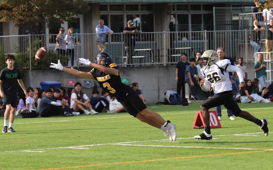 ASIJ’s Shou Murakami-Moses (3) couldn’t quite catch up to this pass, but he did have a 20-yard TD reception for the Mustangs.