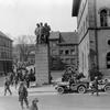 In a photo taken by a  Pfc. Warner of the 166th Signal Photo Co., a U.S. Third Army soldier guards German prisoners in the public square in Kaiserslautern, Germany, as other soldiers mill about, March 21, 1945. The Army seized the southwest German city from the Nazis a day earlier. Today people would recognize the  23rd Monument at center and the Fruchthalle at right.,

 


