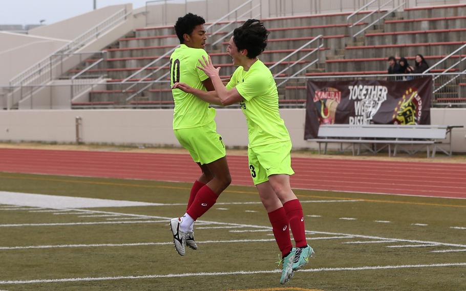 Jalen Cooley and Preston Ramirez celebrate a goal.