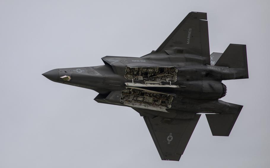 A view of an F-35B Lightning II from below as it flies overhead.