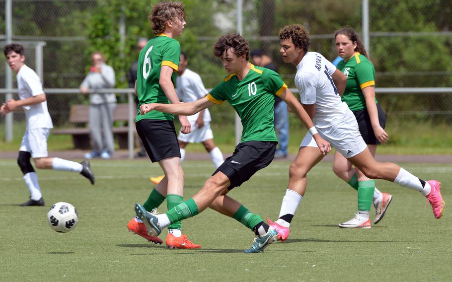 Alconbury’s Leonidas Politis clears the ball with a pass to a teammate in a Division III semifinal against Ansbach at the DODEA-Europe soccer finals in Landstuhl, Germany, May 22, 2024. Politis scored his team’s goal in their 7-1 loss to the Cougars.