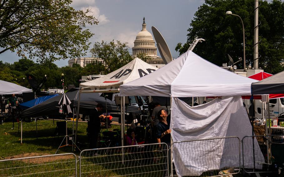 Television crews set up outside of U.S. District Court in D.C. on Wednesday. Federal and local law enforcement officials in Washington have been coordinating security measures for Donald Trump's arrival, including Federal Protective Service vehicles and more protection from the U.S. Marshals Service for judges assigned to his case.