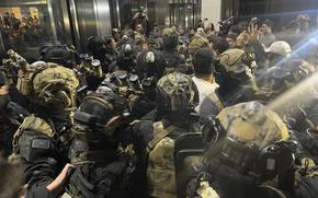 South Korean martial law soldiers try to enter the National Assembly compound in Seoul, South Korea, Wednesday, Dec. 4, 2024. (Cho Jung-woo/Newsis via AP)