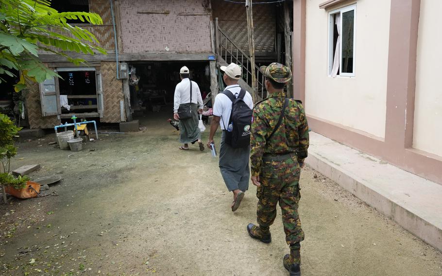 A soldier provides security to census enumerators in Myanmar, Oct. 1, 2024 