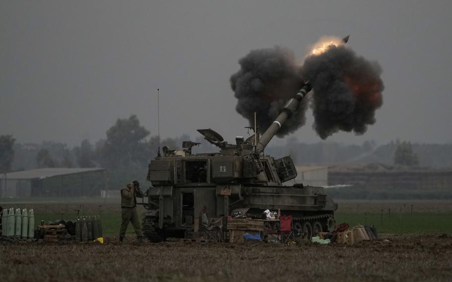 An Israeli mobile artillery unit fires a shell from southern Israel towards the Gaza Strip on Dec. 14.