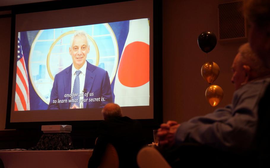 World War II veteran Norman Jay Green watches a video message from U.S. Ambassador to Japan Rahm Emanual during his 100th birthday celebration at the New Sanno Hotel in Tokyo, Nov. 22, 2024.