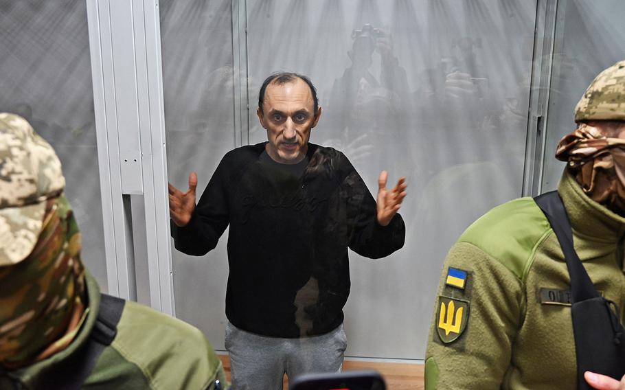 Col. Roman Chervinsky appears in a glass room during a hearing in the Shevchenko District Court in Kyiv, Ukraine, on Oct. 10, 2023. 