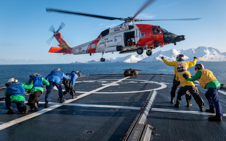 Crew members from Coast Guard Cutter Alex Haley conduct helicopter operations with a Coast Guard Air Station Kodiak MH-60 Jayhawk helicopter aircrew in the Bering Sea on Jan. 8, 2024.