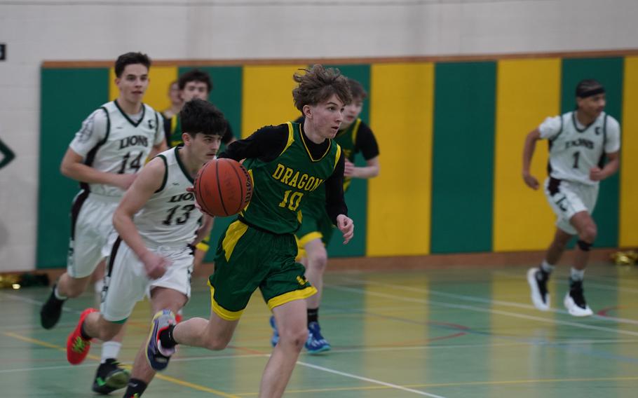 Anthony Sheehan dribbles up court.