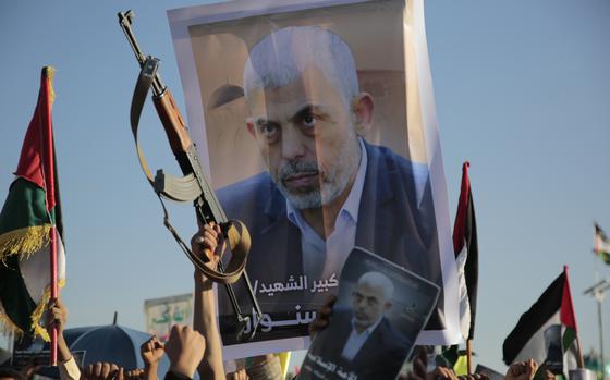 Houthi supporters raise a poster of Hamas leader Yahya Sinwar during an anti-Israel rally in Sanaa, Yemen, Oct. 18, 2024. 