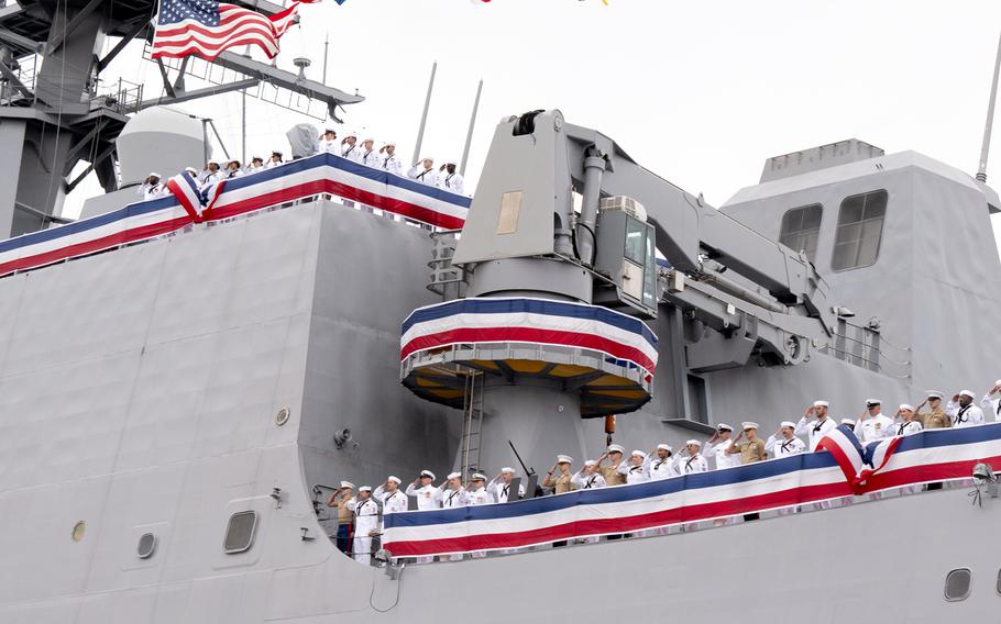 Sailors and Marines salute