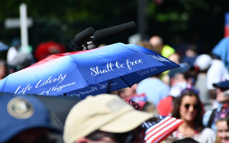 A patron at the National Archives July 4th event carries an umbrella that sports the Declaration of Independence’s preamble. July 4, 2024.