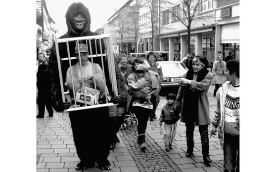 Darmstadt, Germany, March 6, 1992: Shoppers in Darmstadt, Germany, react to the sight of a giant gorilla carrying a human prisoner through their streets. The simian stroll was a promotional stunt for a local store.

Looking for Stars and Stripes’ historic coverage? Subscribe to Stars and Stripes’ historic newspaper archive! We have digitized our 1948-1999 European and Pacific editions, as well as several of our WWII editions and made them available online through https://starsandstripes.newspaperarchive.com/

META TAGS: advertising; Germany; 