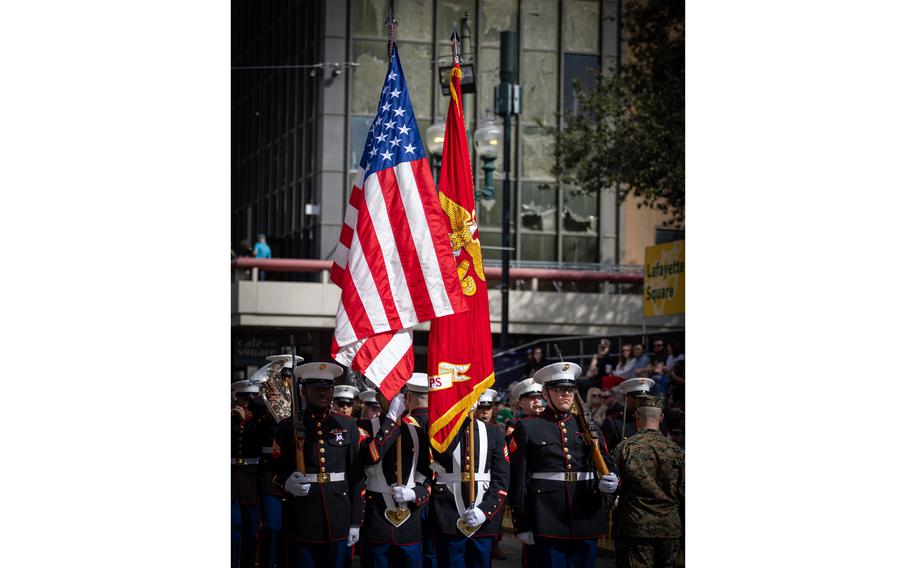 The Marine Forces Reserve Band and Marine Forces South color guard leads the Super Bowl LIX parade