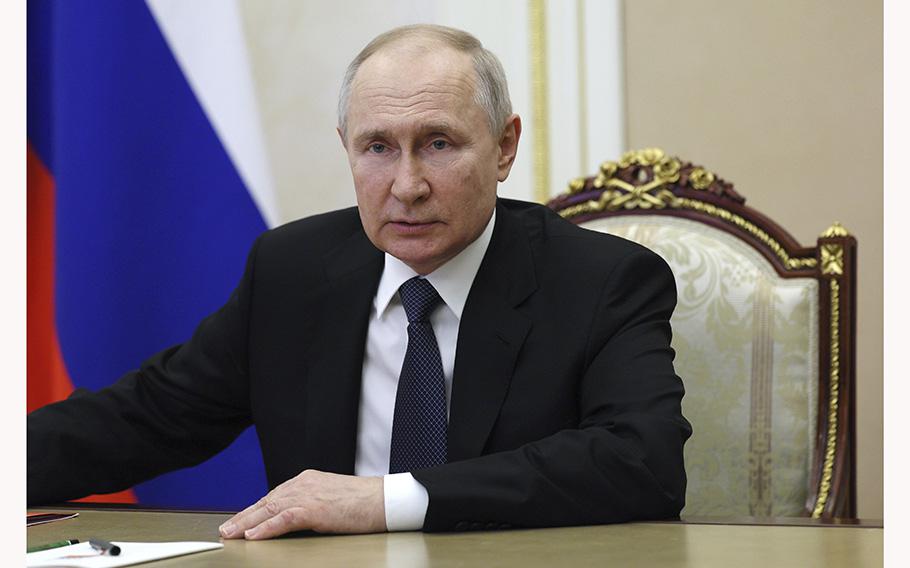 Russian President Vladimir Putin chairs a meeting with members of the Security Council via a video conference in Moscow, Russia, Friday, July 7, 2023.