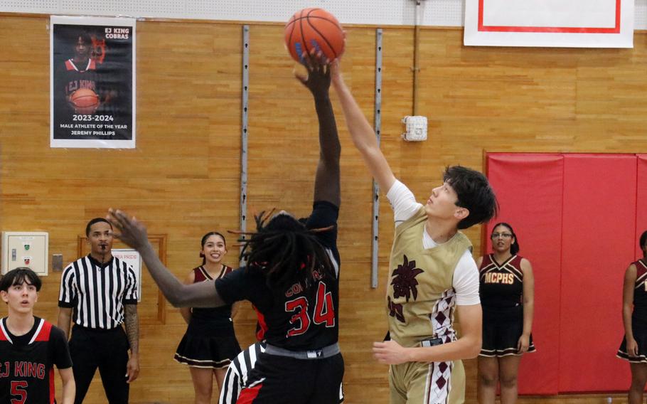 Raphaell Carbe and Sam Kasperski battle for a rebound.