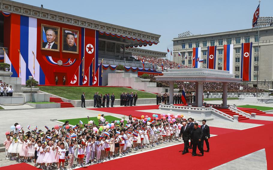 Russian President Vladimir Putin and North Korean leader Kim Jong Un attend the official welcome ceremony in the Kim Il Sung Square in Pyongyang on June 19, 2024. 