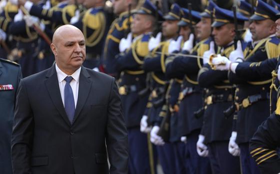  Lebanese President Joseph Aoun reviews the honor guard upon his arrival at the Lebanese Parliament.