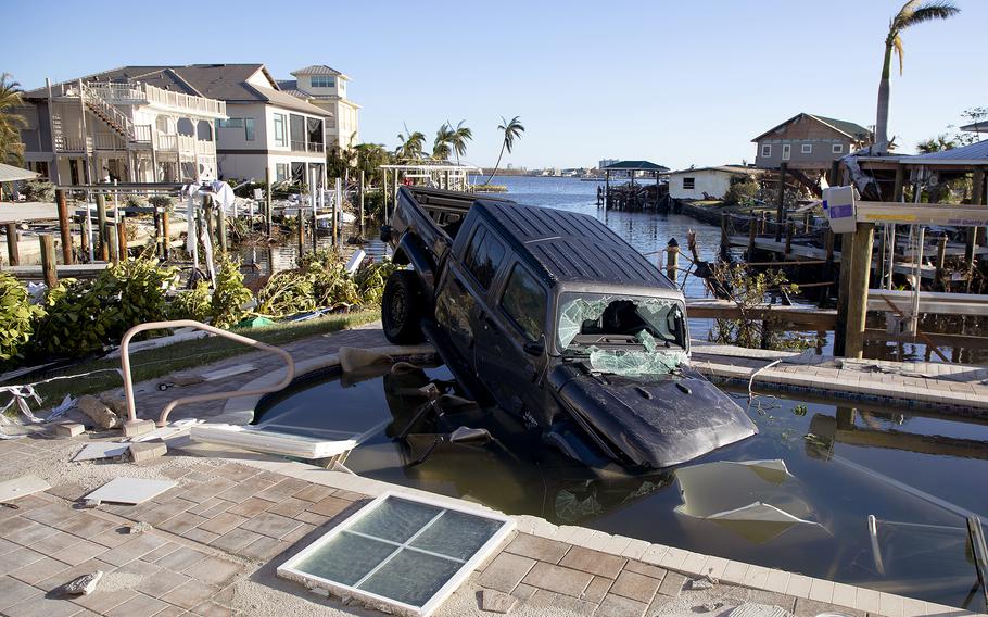 Storm surge from Hurricane Ian washed this truck into a swimming pool in Fort Myers Beach, Fla., in September 2022.