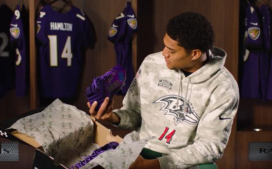 Baltimore Ravens’ safety player, Kyle Hamilton, unboxes the “Our Military Kids” cleats for the first time as part of this NFL season’s “My Cause My Cleats” campaign. He will be wearing the cleats during the Ravens’ game against the Philadelphia Eagles at Baltimore, Md., on Dec. 1, 2024.