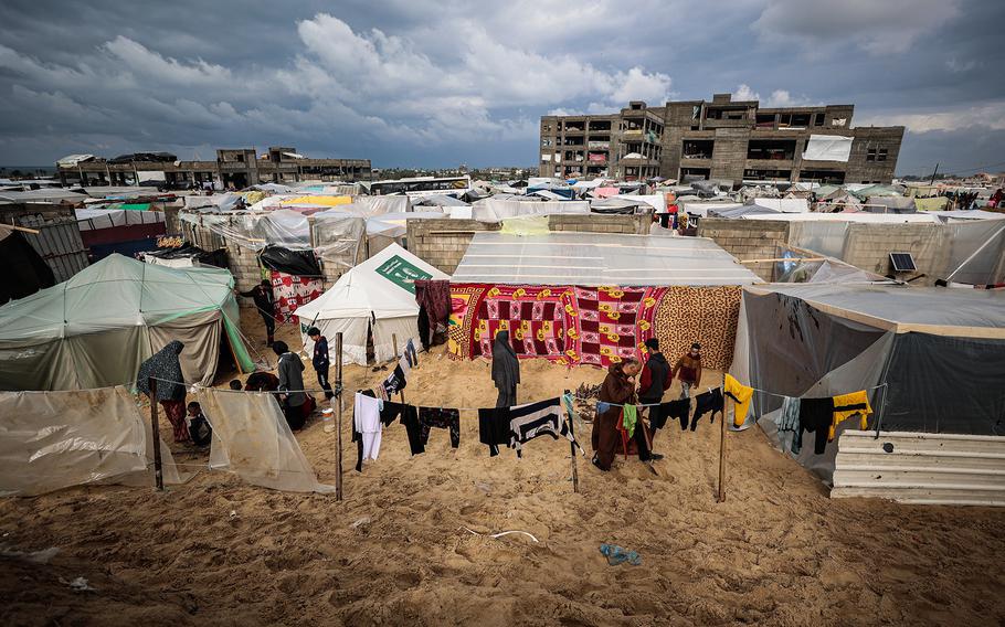 Palestinian families in their tents in the al-Mawasi area of Rafah in the Gaza Strip. .