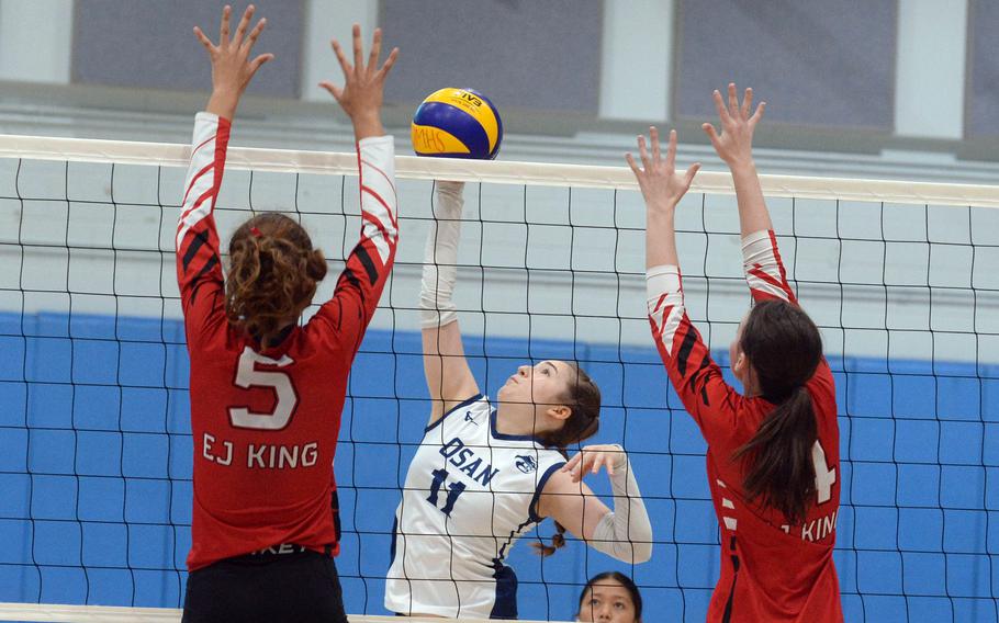 E.J. King and Osan play girls volleyball.