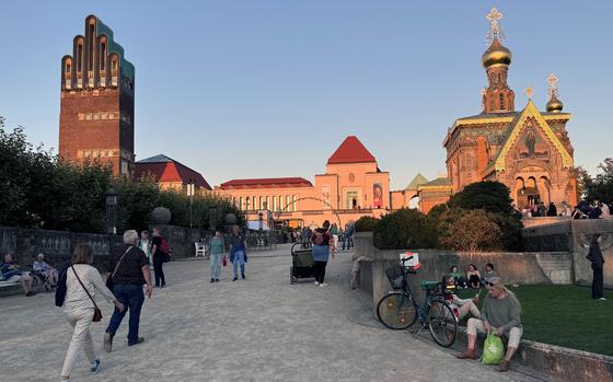 The Wedding Tower, the newly renovated Exhibition Hall and the Russian Chapel on the Mathildenhoehe in Darmstadt, Germany, glow in an autumn sunset. The Wedding Tower and Exhibition Hall were built in 1908, the Russian Chapel in 1899.

