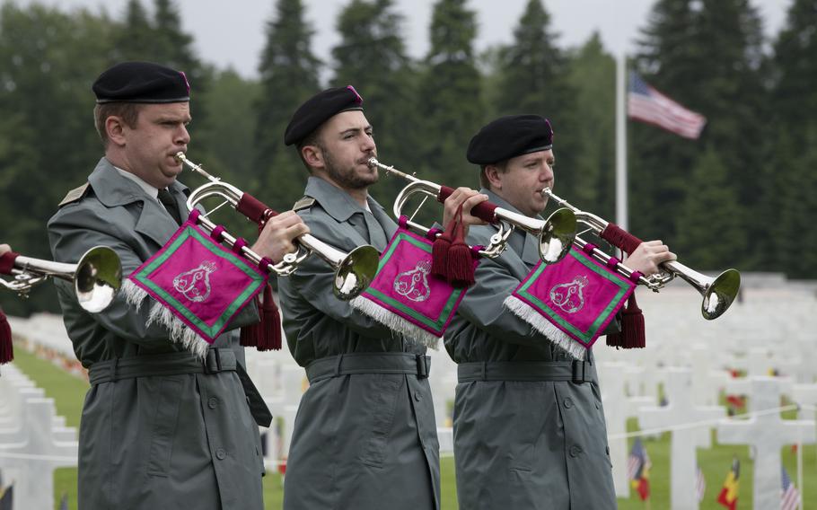 Members of Belgium’s Royal Music of the Guides play taps at a Memorial Day ceremony at Ardennes American Cemetery in Neupré, Belgium, on May 25, 2024.