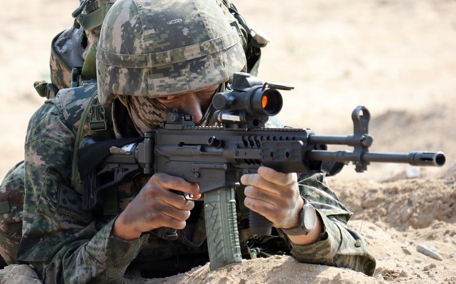 A South Korean marine takes aim while training in Pohang, South Korea, March 29, 2023.